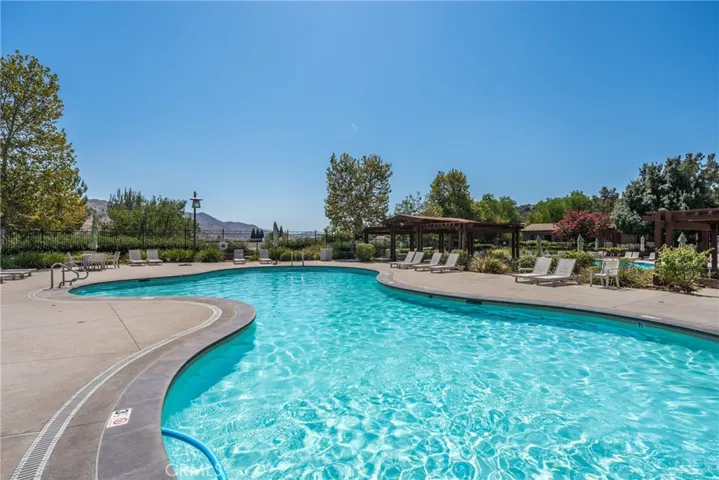 Large sparkling community pool surrounded by scenic mountain views.
