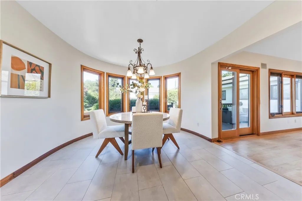 The charming breakfast nook overlooks the beautiful side yard. The charming breakfast nook overlooks the beautiful side yard.