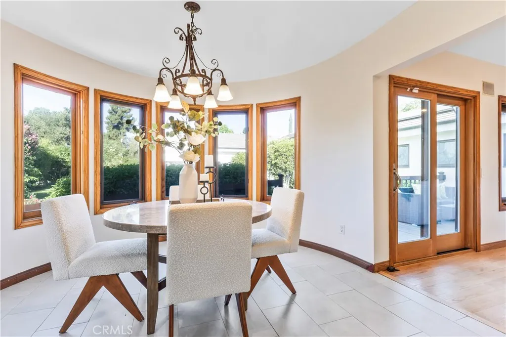 The charming breakfast nook overlooks the beautiful side yard. The charming breakfast nook overlooks the beautiful side yard.
