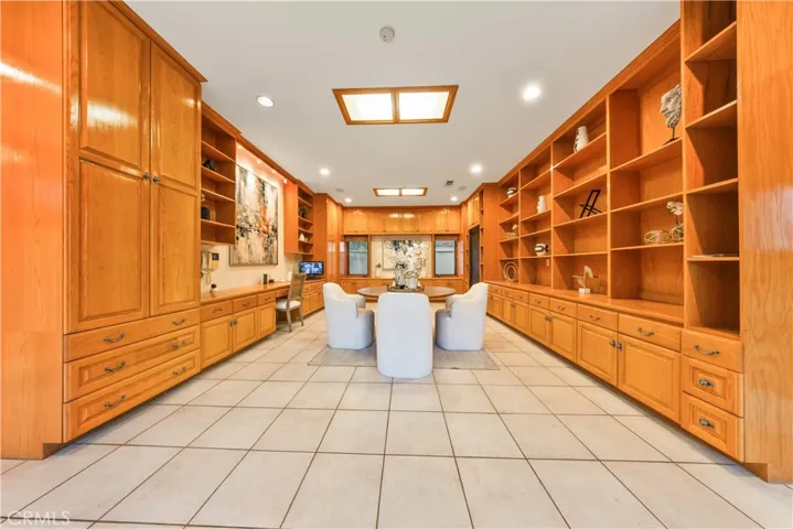 Huge recreation room with sliding glass doors providing direct access to the side yard.