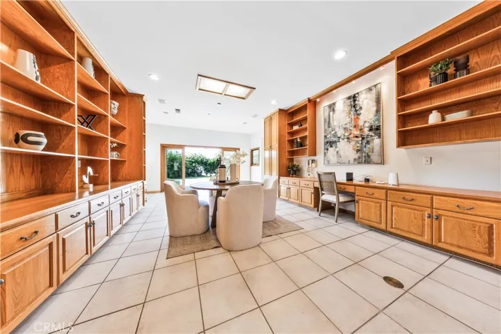 Huge recreation room with sliding glass doors providing direct access to the side yard.