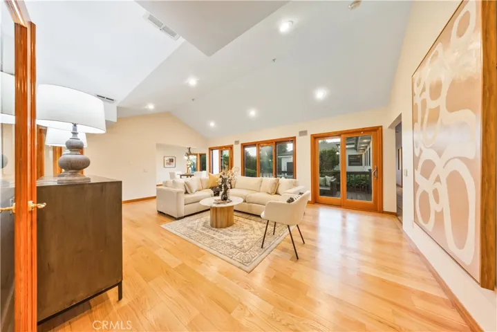 Bright and spacious family room with a sliding glass door that opens directly to the deck.