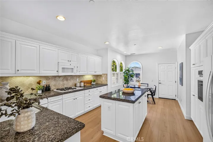 Bright kitchen with new flooring and updated appliances