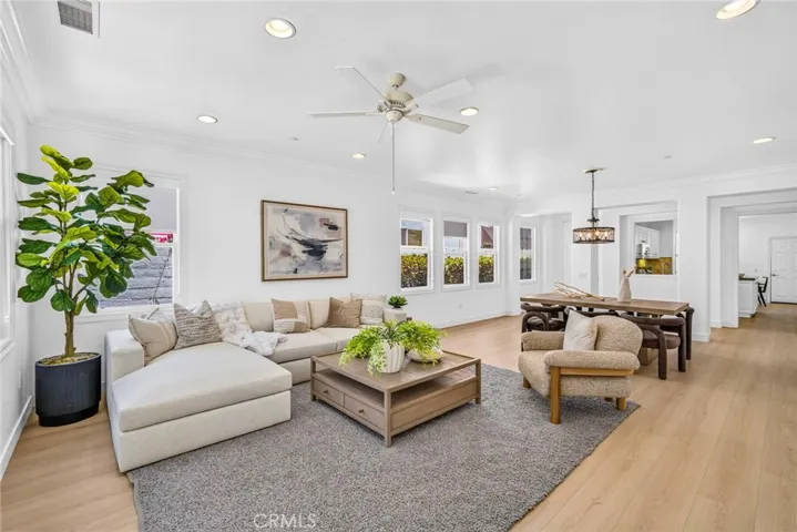 Main living area with dining room space and new chandelier