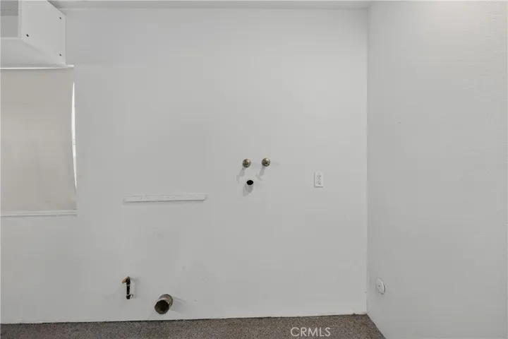 Laundry hook-ups area in the garage.