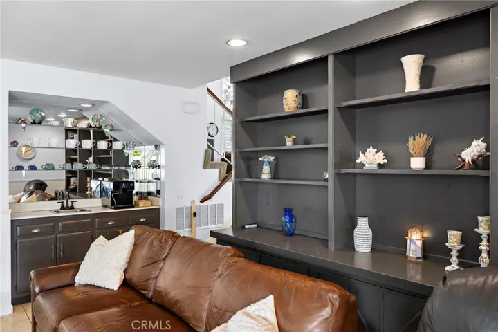 downstairs den with custom builtin shelves!