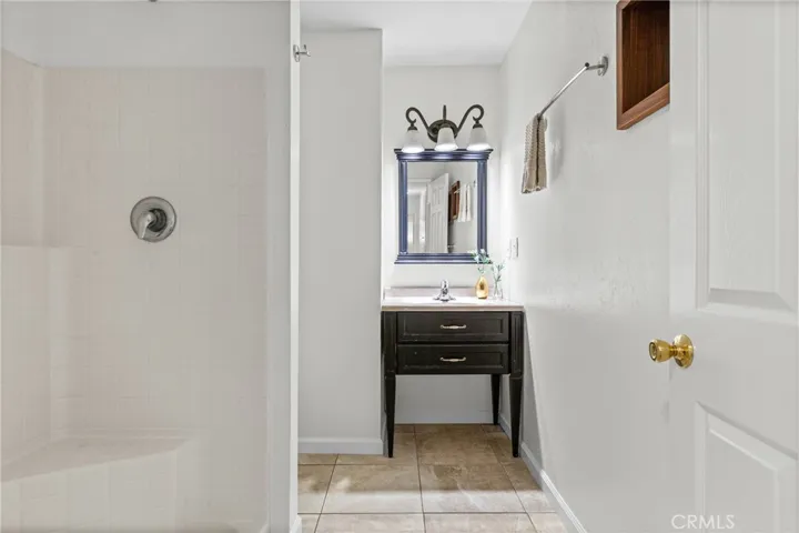 Bathroom near entrance with walk in shower