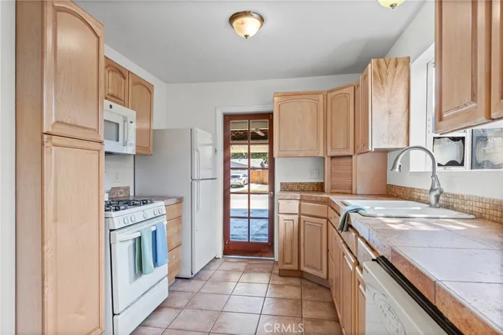 Kitchen with access to garage and laundry