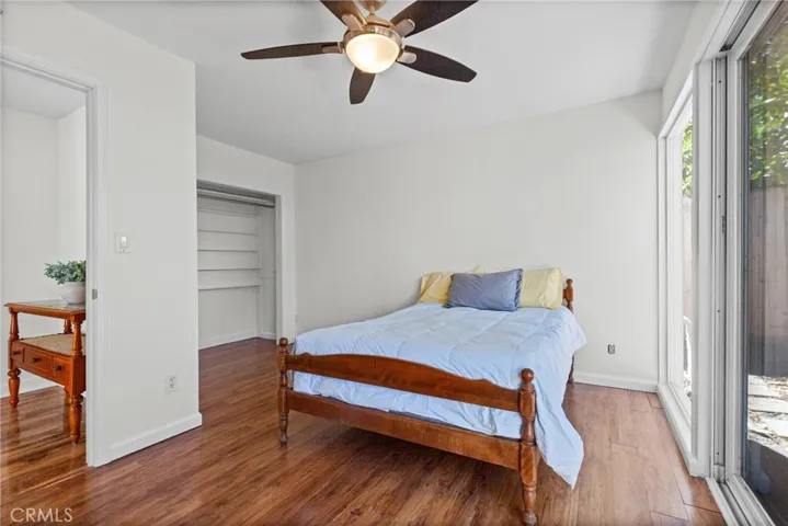 Guest room with sliding doors to rear yard