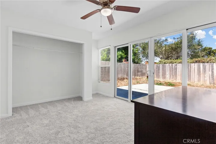 Guest room with sliding doors to rear yard