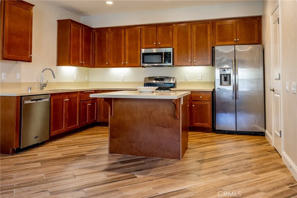 The kitchen offers abundant cabinetry for storage and lots of countertop space for preparing meals.