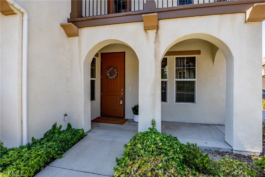 A covered front porch welcomes you to the home and is a great place to greet guests.