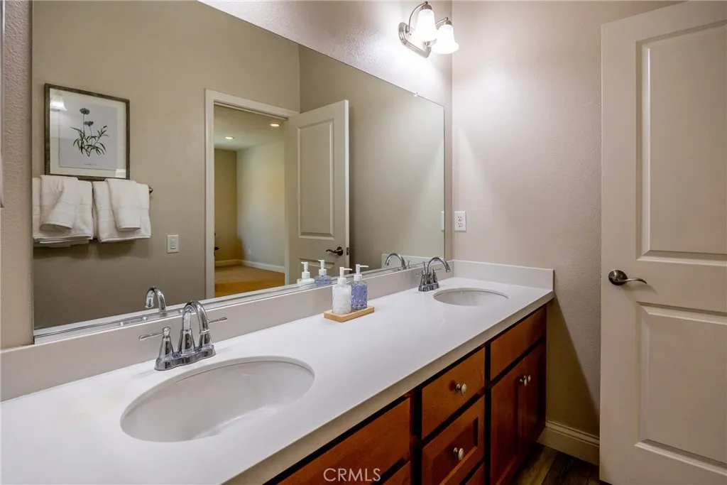 The main bathroom offers a dual sink vanity.