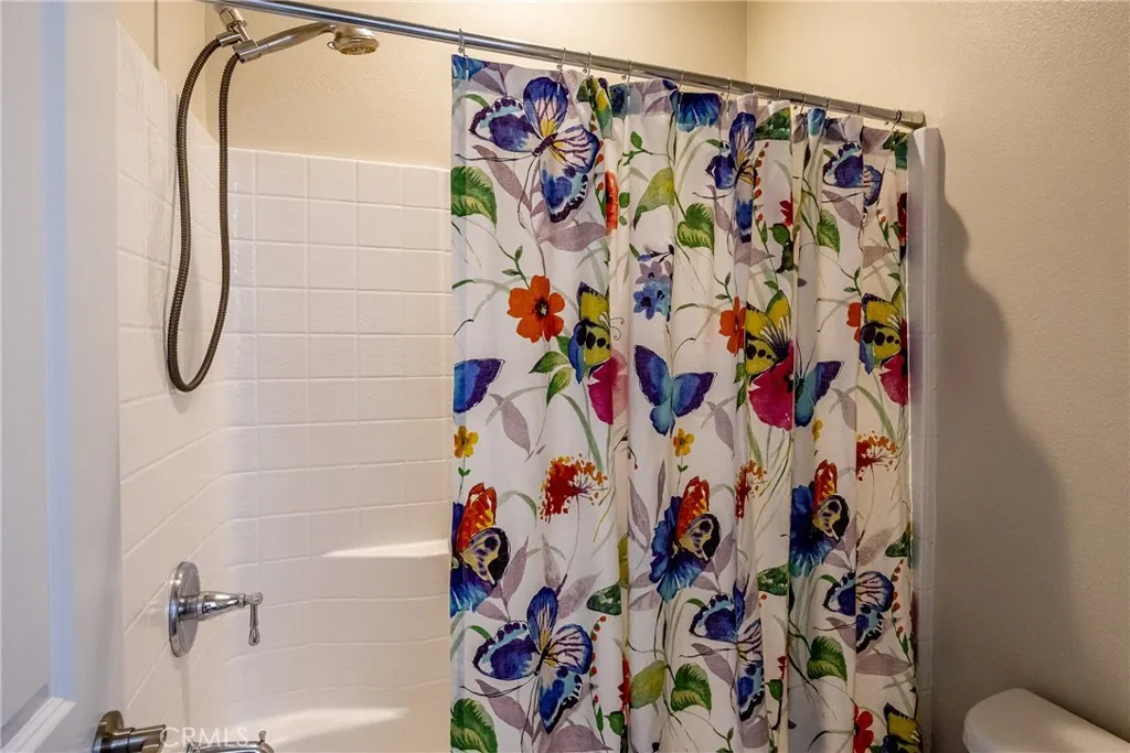 Separate shower and commode make sharing the bathroom easy.