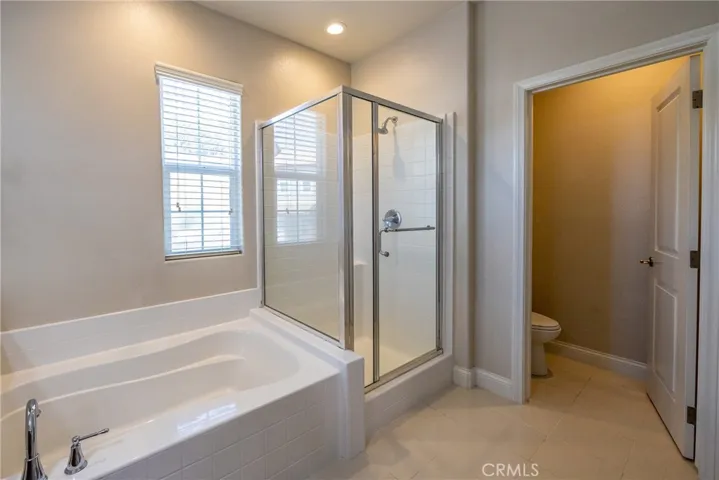 Separate shower and soaking tub. The commode is also in its own room.