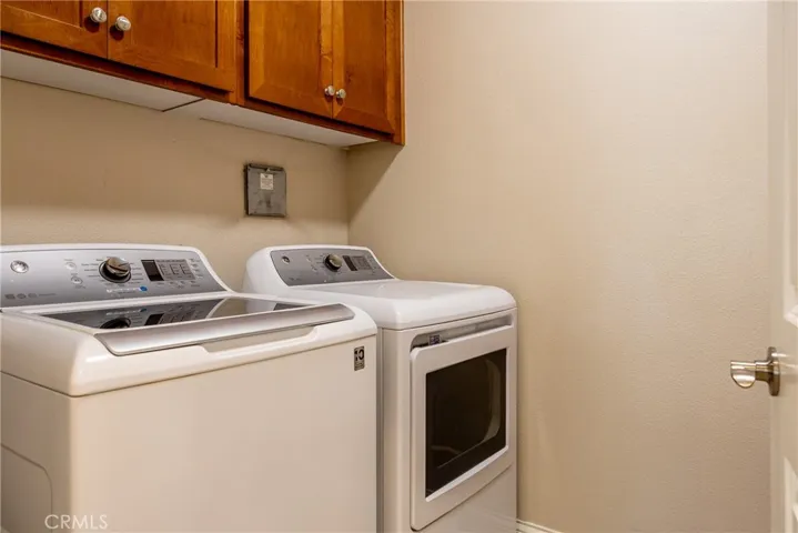 Off the family room is the laundry room. Washer and dryer are included!