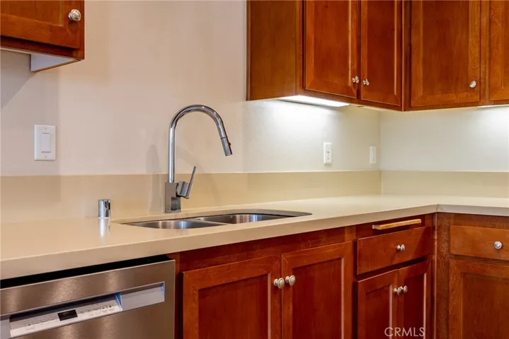 Double basin sink and under cabinet lighting add a refined look.