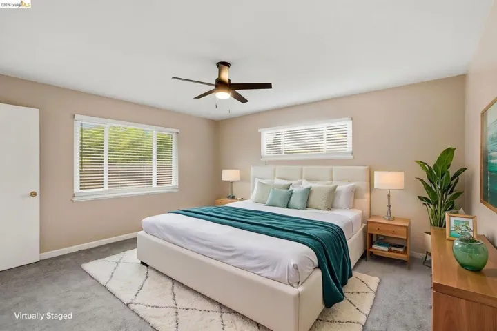 Soft neutral walls complement gray carpet flooring