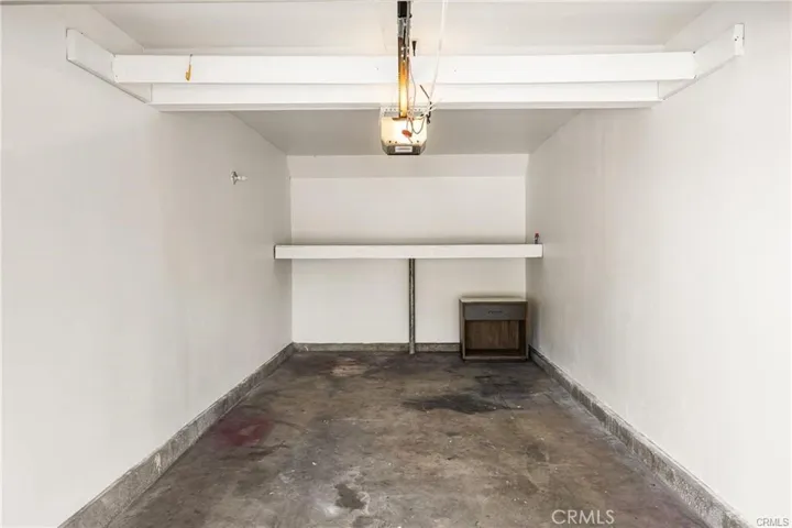 Long garage with spacious storage at front.