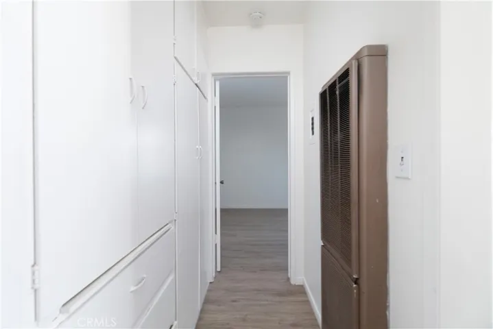 Hlalway with storage and water heater cabinet