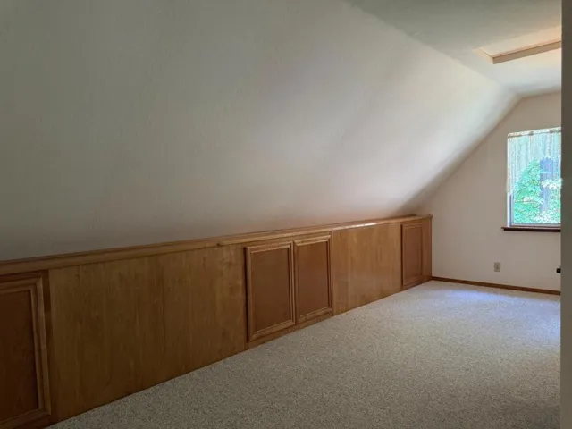 One view of the large landing with concealed storage at the top of the stairs