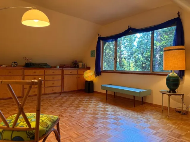 Another angle of this upstairs bedroom and its forest view