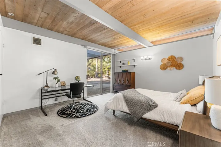 Bedroom 2 and sliding glass doors that lead to the backyard