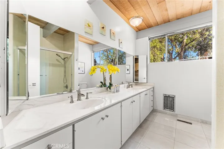 Hall bathroom with dual vanities