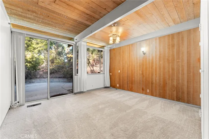 Bedroom 3 with sliders that open to the side yard