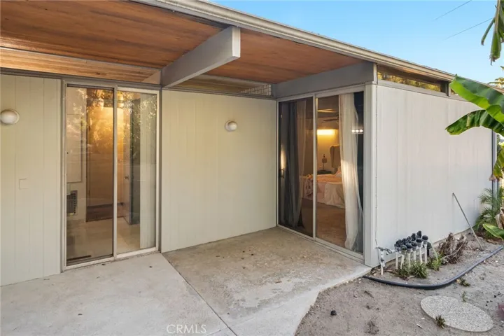 Intimate patio off the primary bedroom and bath.  Sip coffee on a lazy weekend morning as you read a book or your morning newspaper