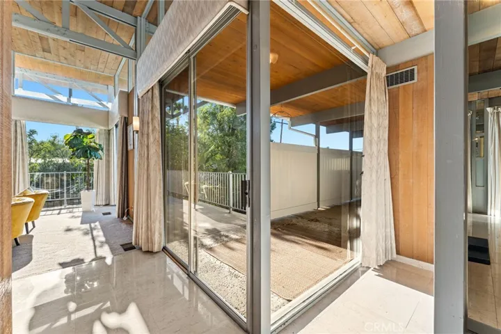 Sliding glass doors abound providing plenty of natural light