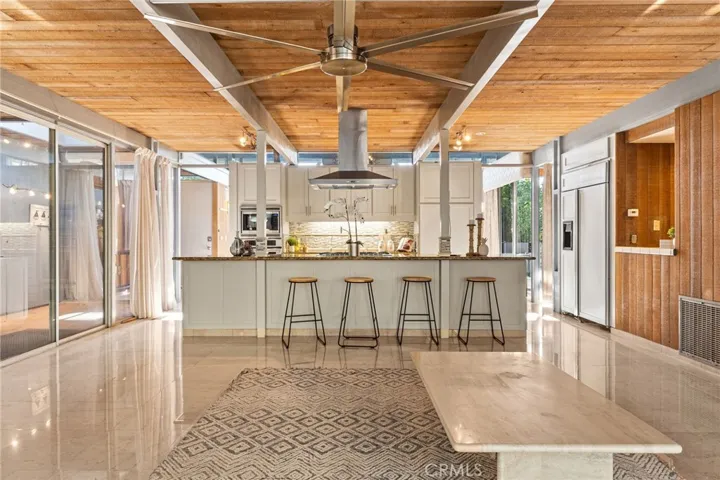 Kitchen with built in fridge and wet bar ready for entertaining