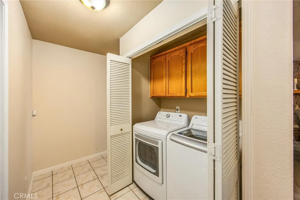 indoor laundry closet with storage
