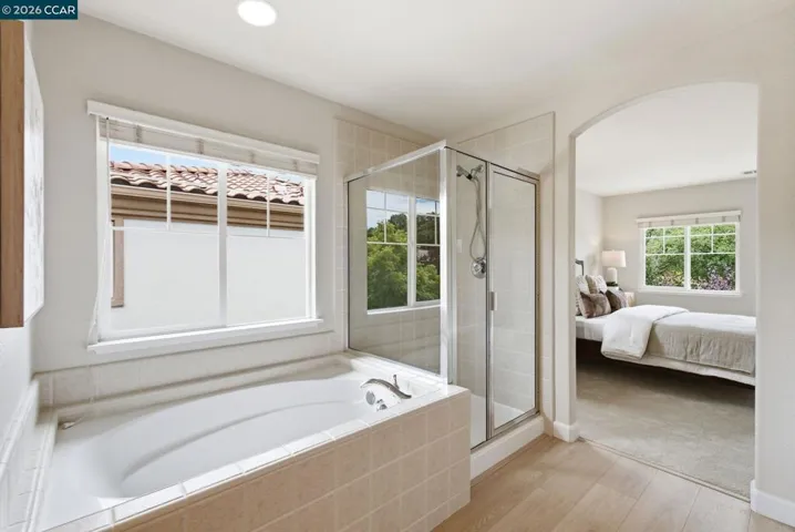 Ceiling light above tub digitally turned on.
