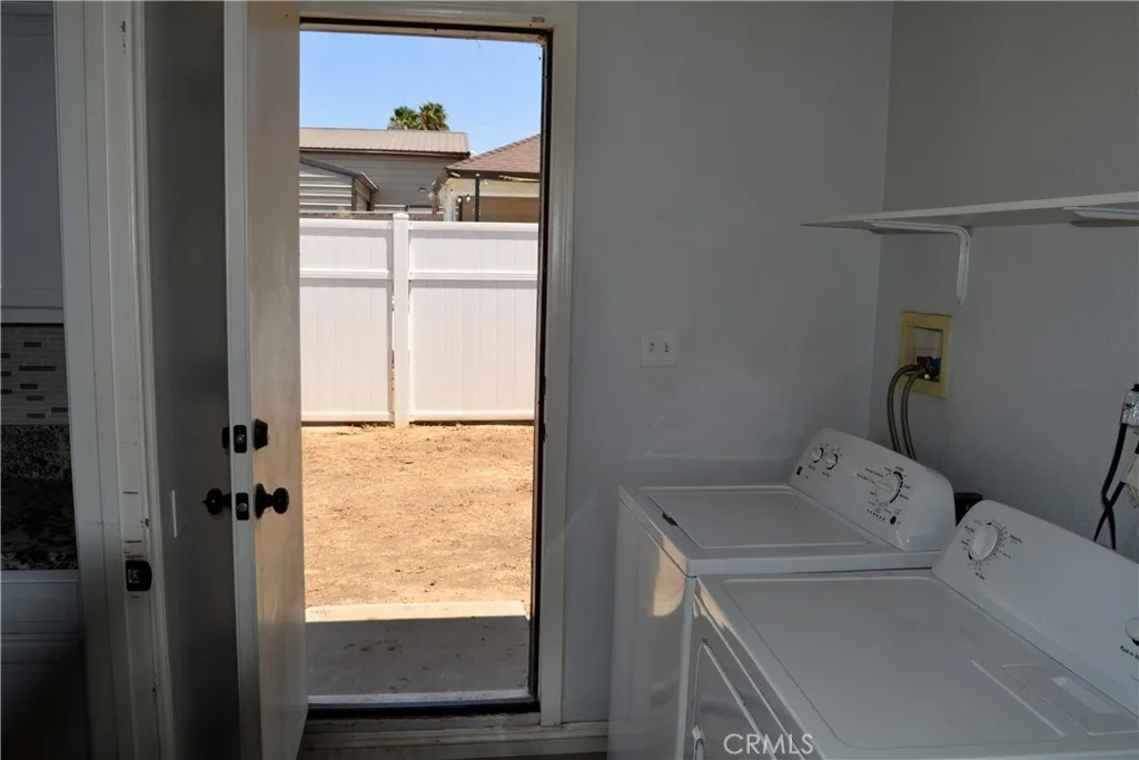 Laundry area and backdoor to left side of the house.