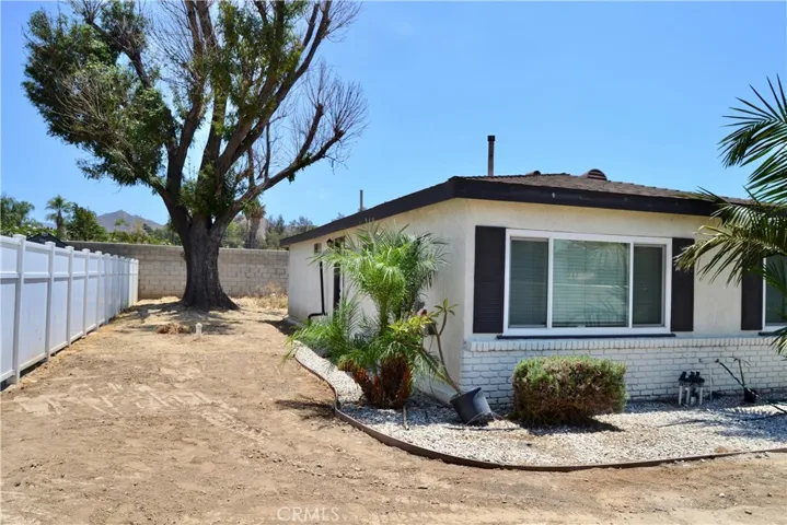 Left side of the house.