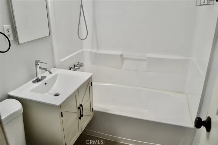Bathroom at the end of the hallway.