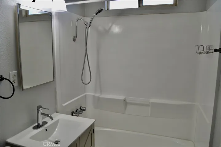 Bathroom at the end of the hallway.