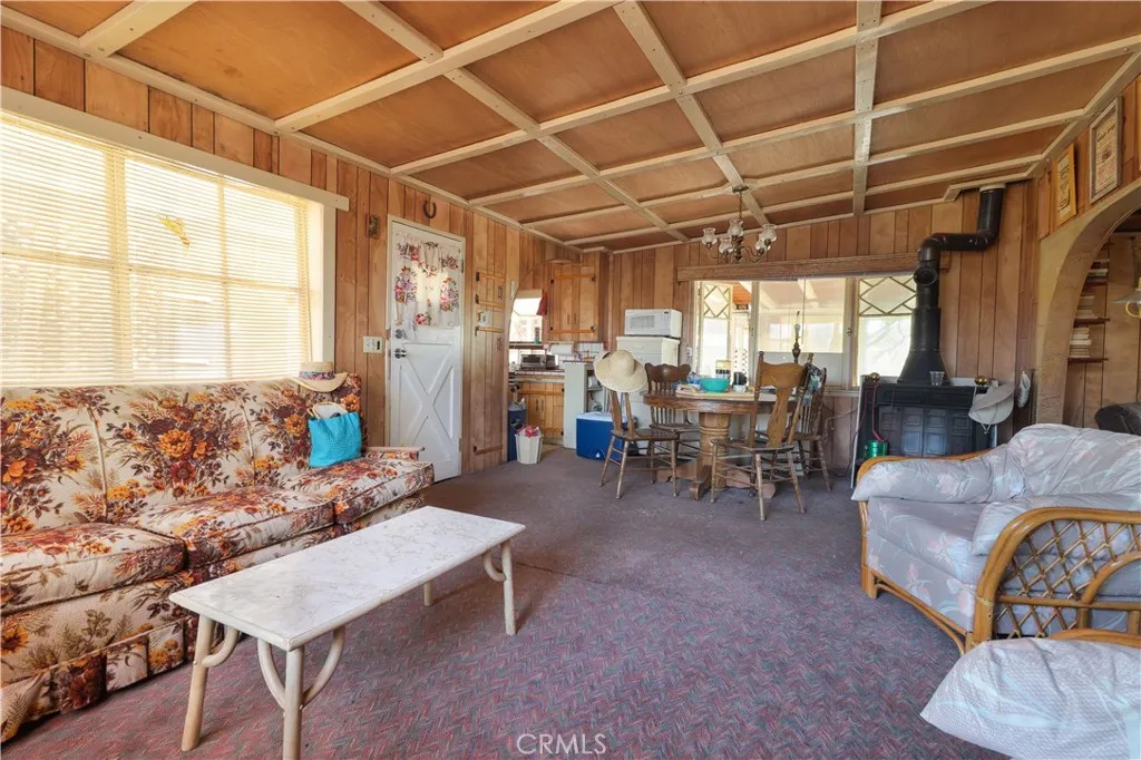 Living area with view to dining area and kitchen.