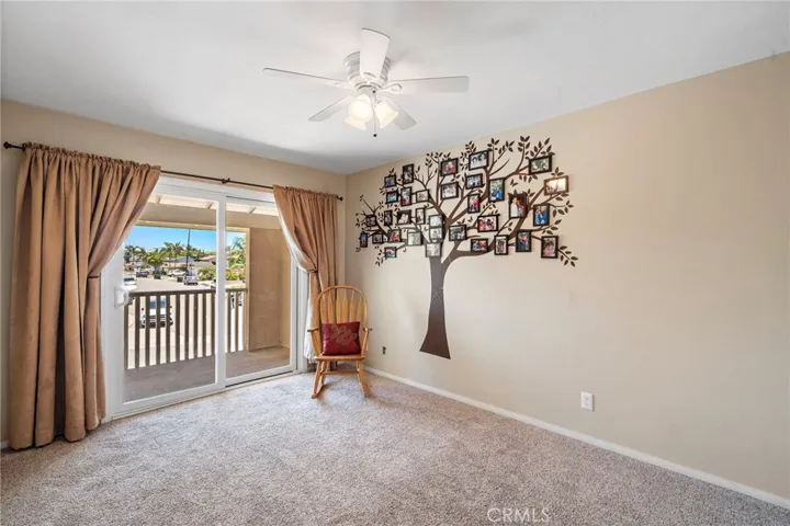 Two additional bedrooms include access to the front balcony