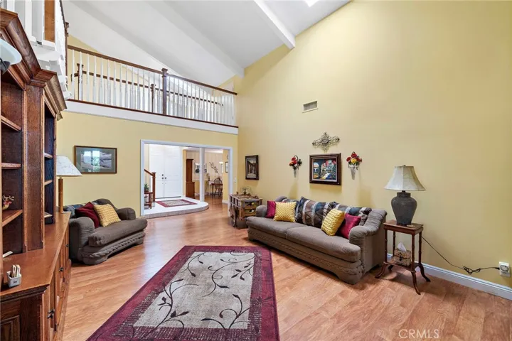  The living room boasts soaring ceilings