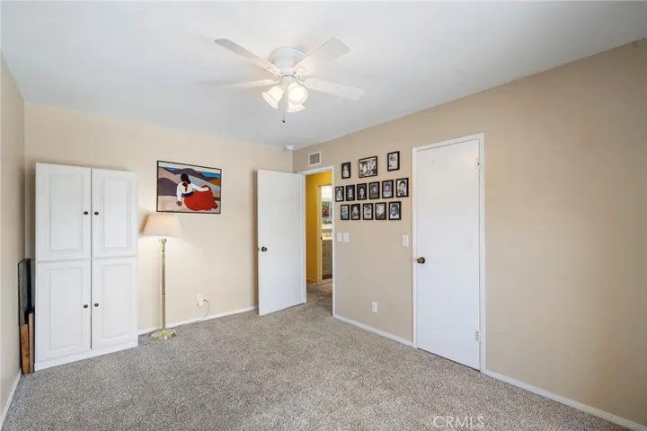 Two additional bedrooms include walk-in closets and ceiling fans