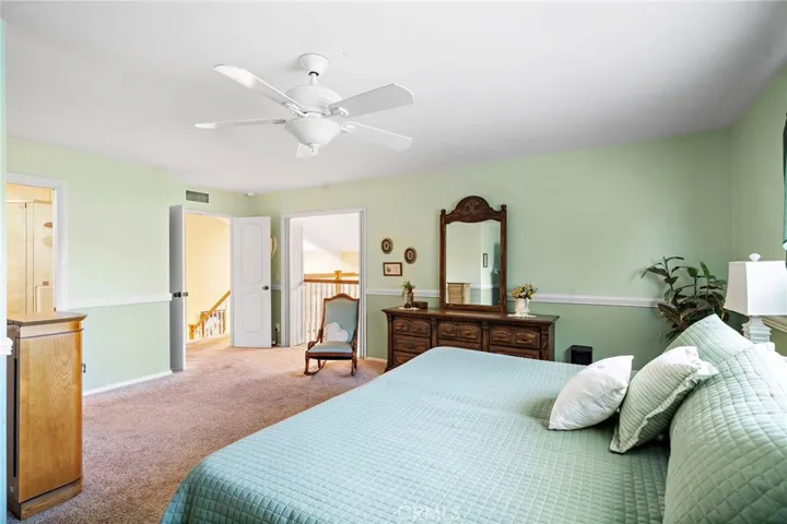 the primary suite features double-door entry, a Juliet balcony