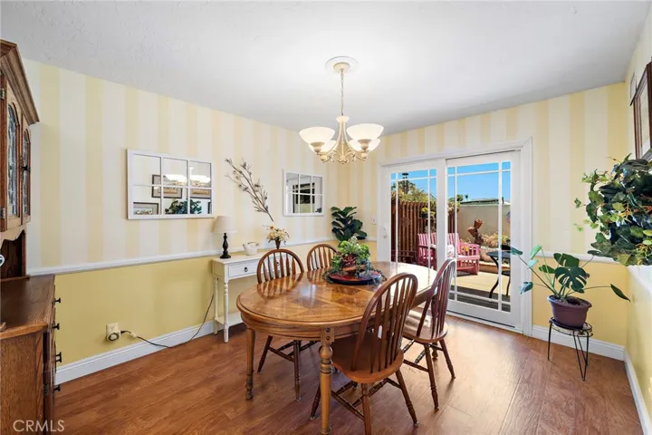 The formal dining room overlooks the backyard and opens to a private composite deck