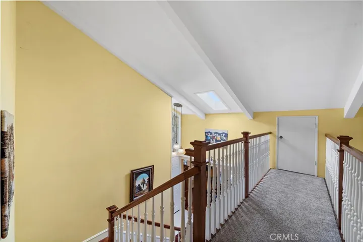 hardwood stairs, railings and banisters. walk-in attic storage