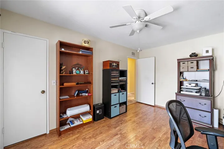 Two additional bedrooms include walk-in closets and ceiling fans