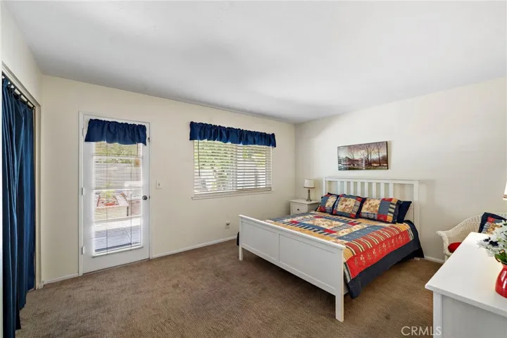 A downstairs bedroom with backyard access