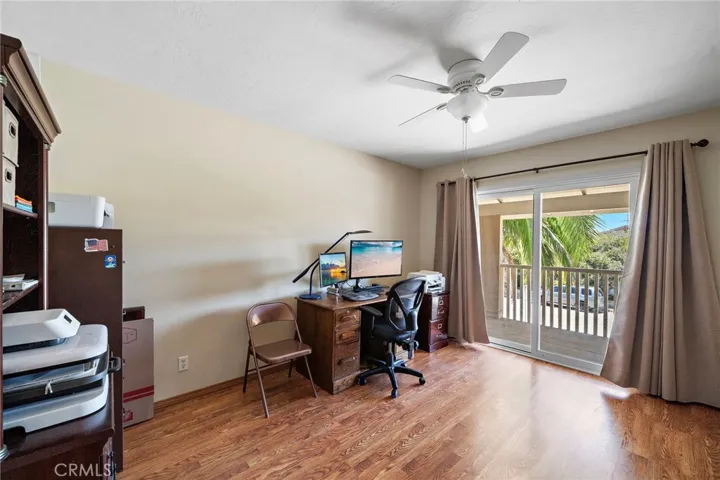 Two additional bedrooms include access to the front balcony