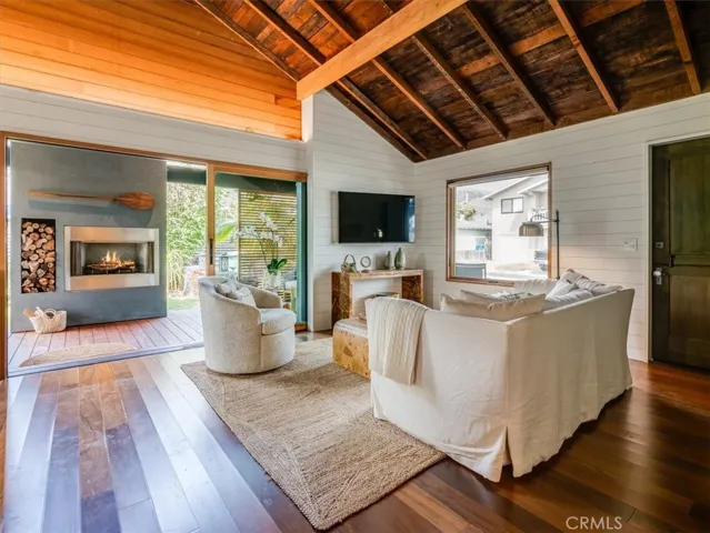 Living Room Opens to Covered Patio and Outdoor Fireplace