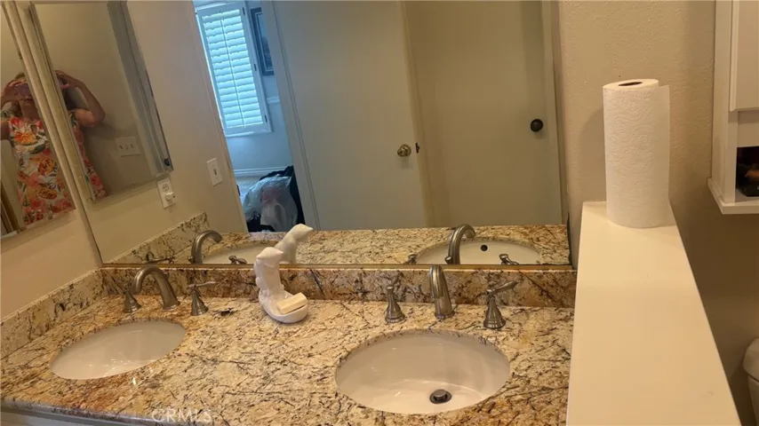 primary bathroom with a double vanity.